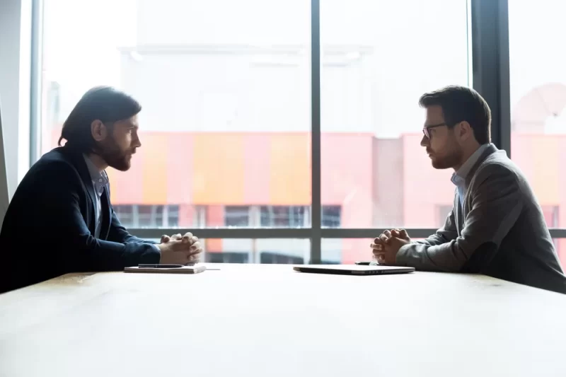 Two people meeting about a DSCR home loan