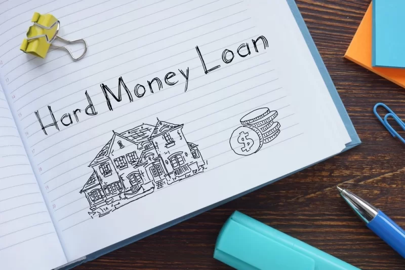 A professional discussing investment properties with a hard money loan broker